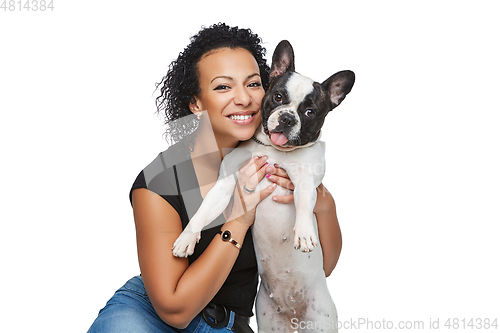 Image of young woman with french bulldog dog