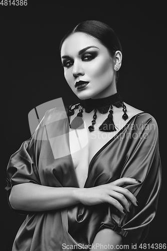 Image of beautiful young woman with dark makeup