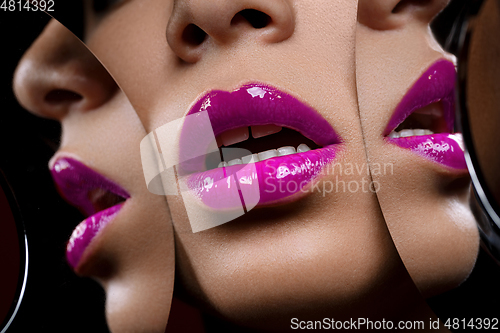 Image of beautiful woman lips closeup with mirror reflections