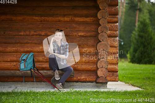 Image of young woman with nordic walk pols