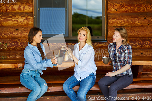 Image of young women drinking tea