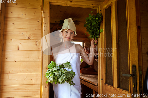 Image of beautiful girl relaxing in sauna