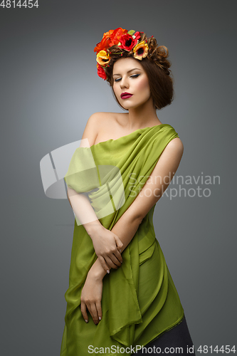 Image of girl in long dress with flowers on head