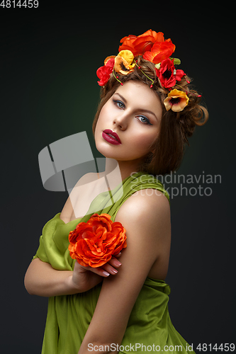 Image of girl in long dress with flowers on head