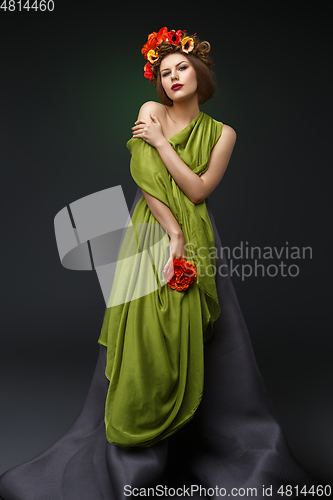 Image of girl in long dress with flowers on head