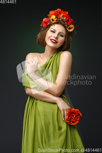 Image of girl in long dress with flowers on head