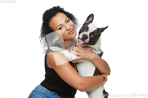 Image of young woman with french bulldog dog