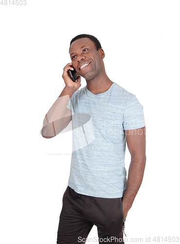 Image of Man talking and smiling at his phone