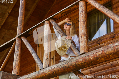 Image of young woman resting in countyside house