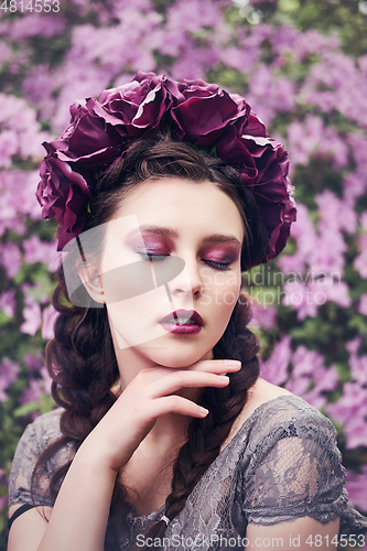 Image of girl in dress in rhododendron garden