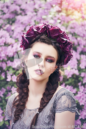 Image of girl in dress in rhododendron garden