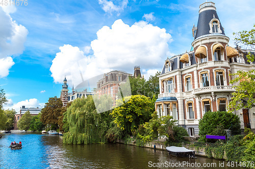 Image of Amsterdam canals and  boats, Holland, Netherlands.