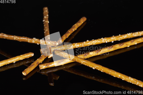 Image of salt sticks on dark ground