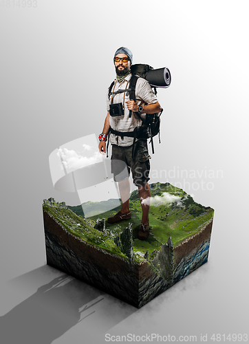 Image of Travel and vacation concept. Traveler on cut of the ground and the grass landscape with the cut of the mountain field.