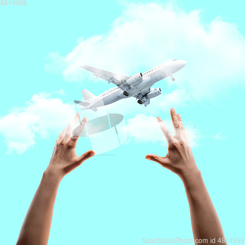 Image of Contemporary art collage, modern design. Summer mood. Human hands catching big flying plane on blue sky