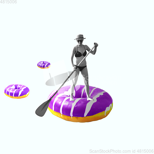 Image of Contemporary art collage, modern design. Summer mood. Woman swimming on big purple donut like on kayak on white