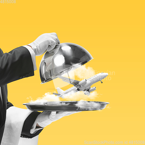 Image of Contemporary art collage, modern design. Summer mood. Waiter serving air vacation with plane on yellow