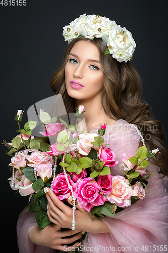 Image of beautiful girl with pink makeup and flowers