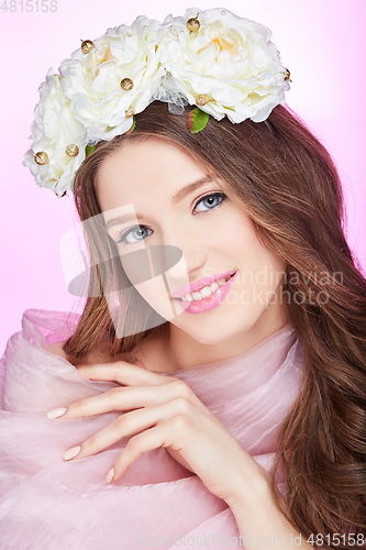 Image of beautiful happy girl with pink makeup and flowers