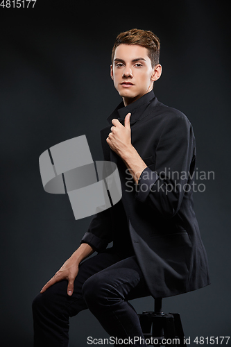 Image of handsome young man in black jacket