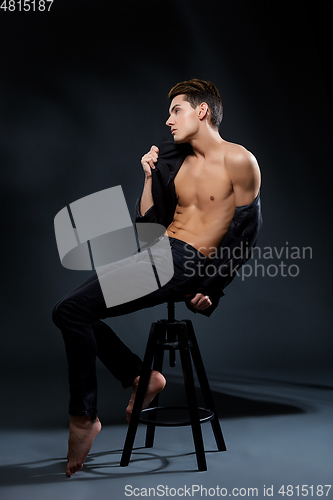 Image of handsome young man in black jacket