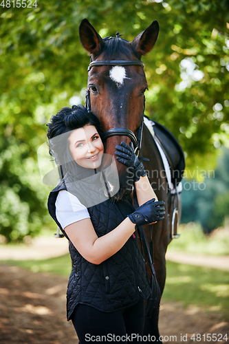 Image of beautiful girl with horse