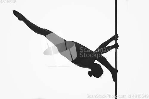 Image of beautiful pole dancer girl silhouette