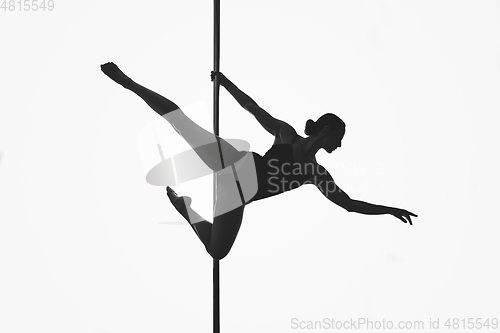 Image of beautiful pole dancer girl silhouette