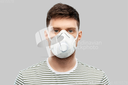 Image of man in protective medical mask or respirator