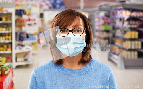 Image of senior woman in medical mask at supermarket