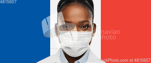 Image of african american doctor in medical mask in france