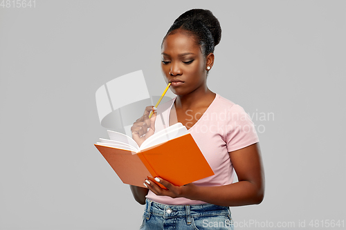 Image of african american woman with notebook