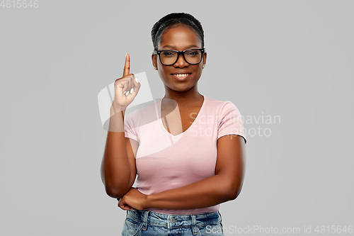 Image of african american woman in glasses with finger up