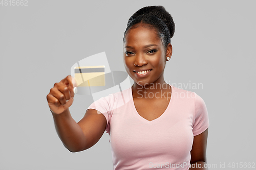 Image of happy african american woman with credit card