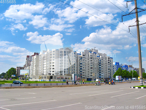 Image of view of multistory modern blocks of flat and town road