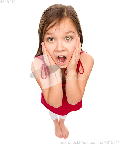 Image of Little girl is holding her face in astonishment