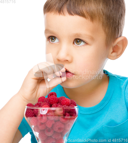 Image of Little boy with raspberries