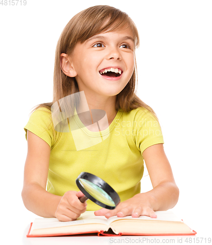 Image of Little girl is reading book