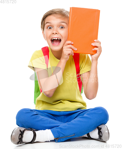 Image of Portrait of a cute little schoolgirl with backpack