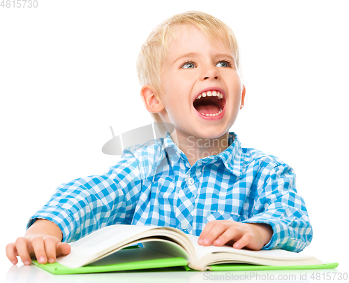 Image of Little child play with book