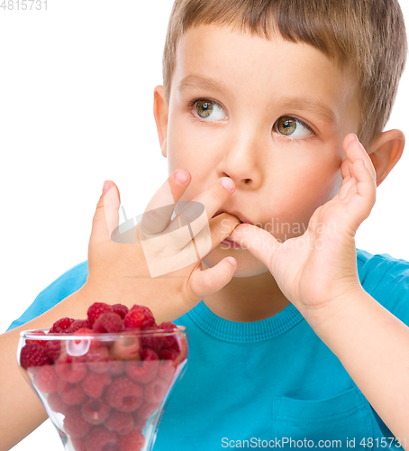 Image of Little boy with raspberries