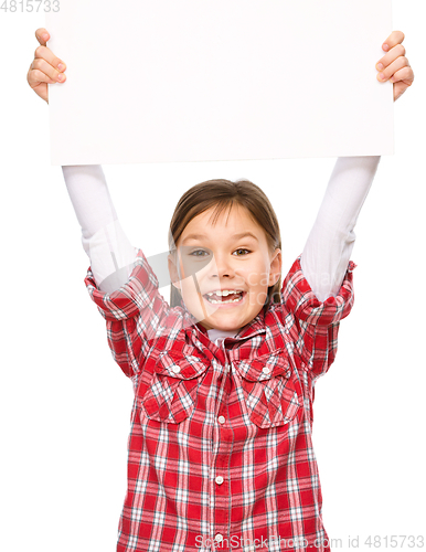 Image of Little girl is holding a blank banner