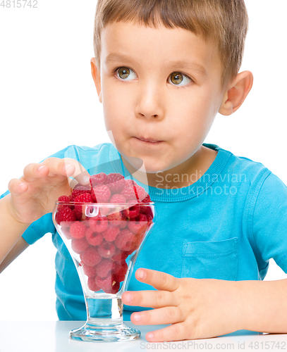 Image of Little boy with raspberries