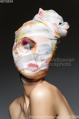 Image of girl with heavy makeup and bandage on head