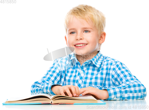 Image of Little child play with book