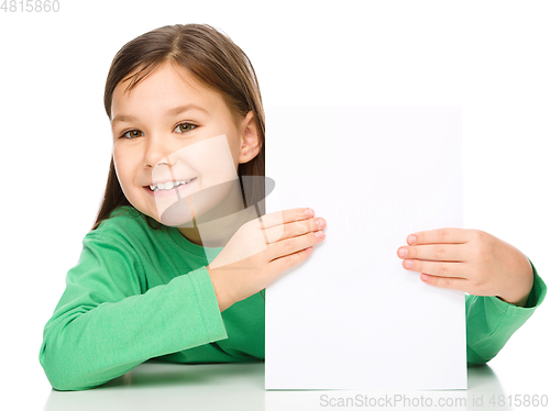 Image of Little girl is looking from out blank board