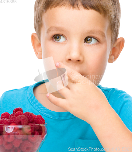 Image of Little boy with raspberries