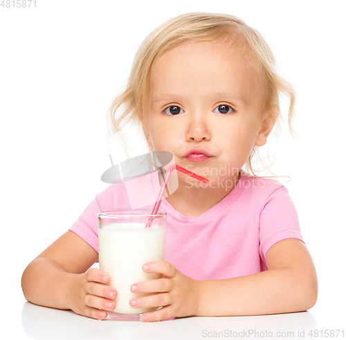 Image of Cute little girl with a glass of milk