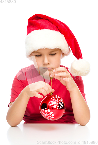 Image of Young unhappy girl in christmas cloth