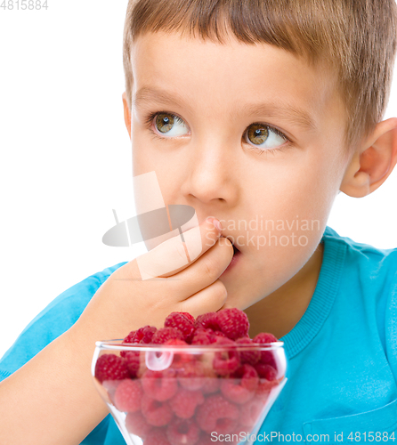 Image of Little boy with raspberries